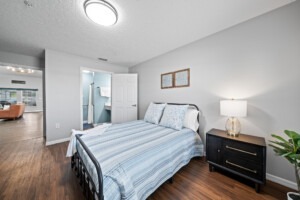 Palm cottages bedroom with double bed and attached bathroom