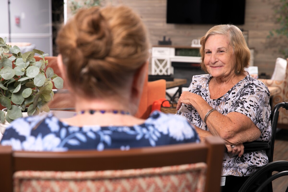 Lady sitting and talking with a friend