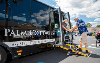 residents boarding Palm Cottages bus for an outing