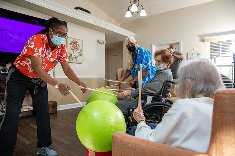 care giver and elderly woman in assisted living facility near orlando