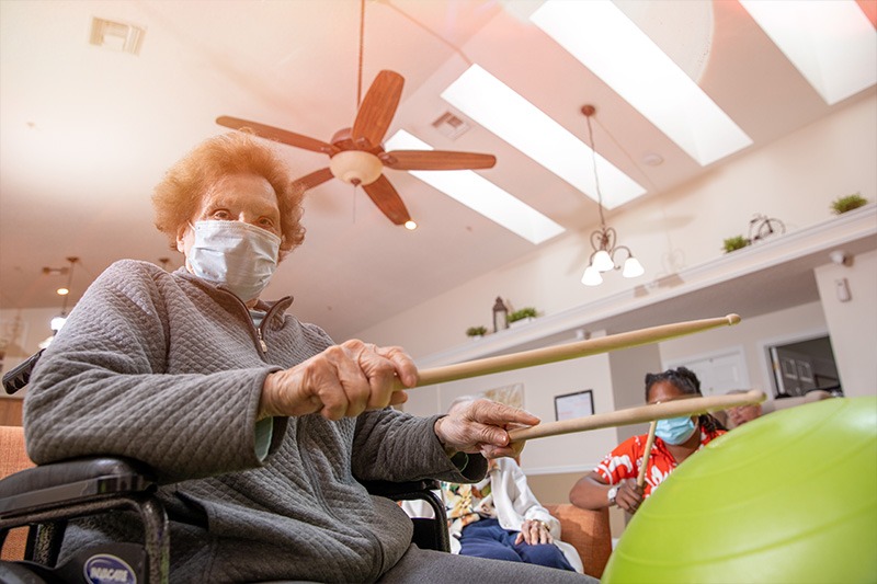 elderly female resident participating in activity