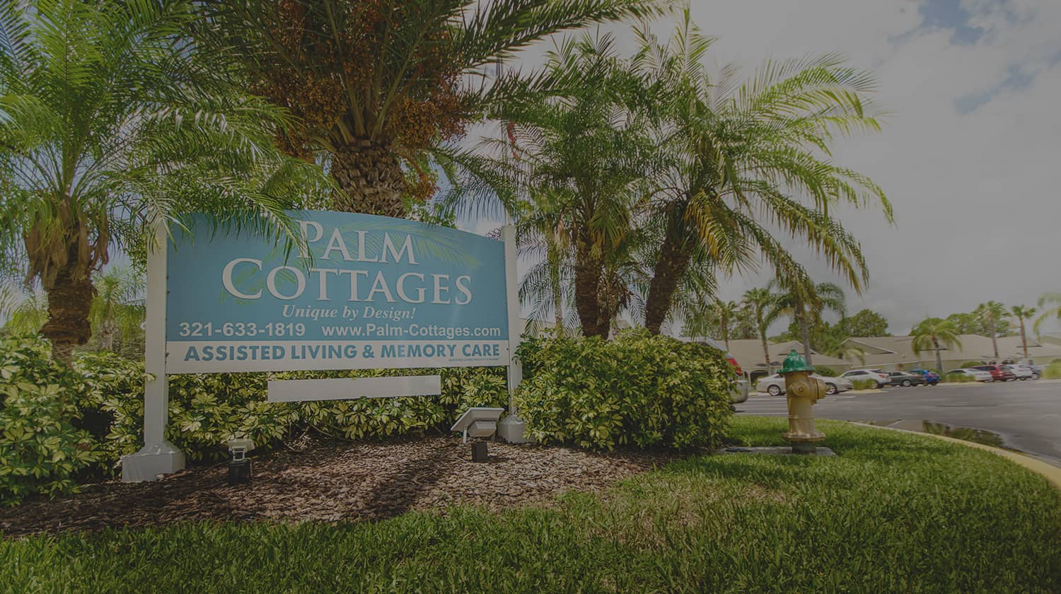 Palm Cottage assisted living facility exterior with sign