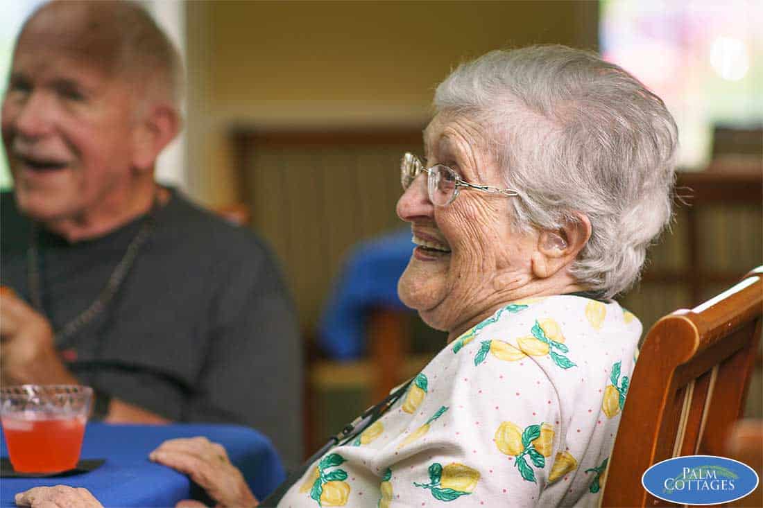 assisted living facility residents enjoying a meal together