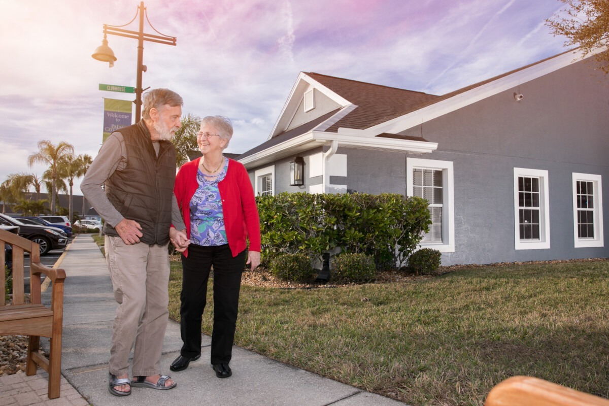 Two residents walking on the sidewalk